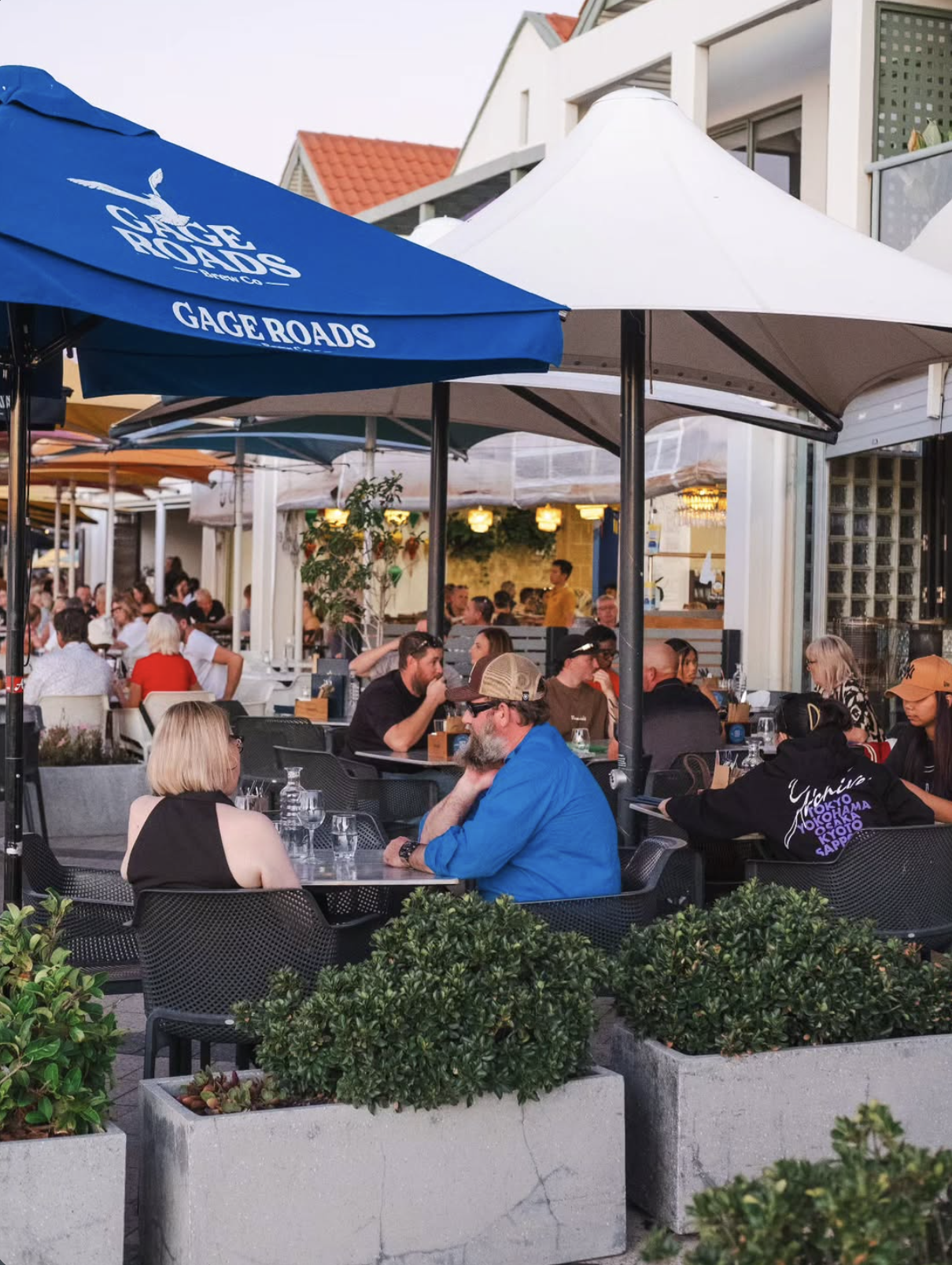 Guests dining on the outdoor terrace at Latitude 32